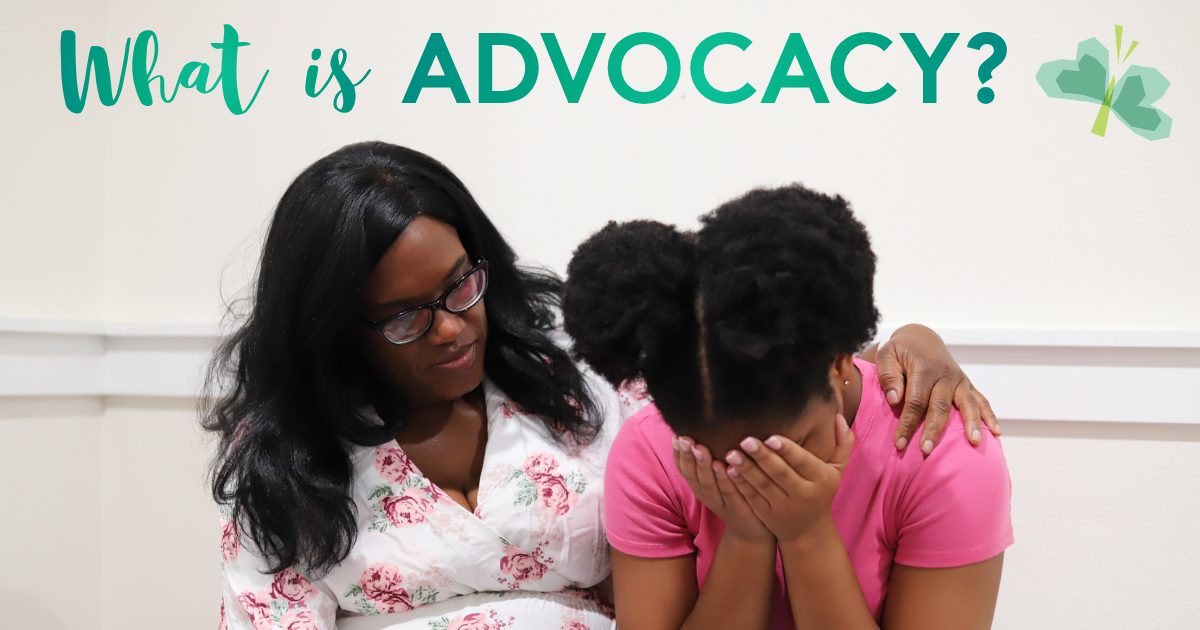 An ECCAC child advocate comforts a young girl